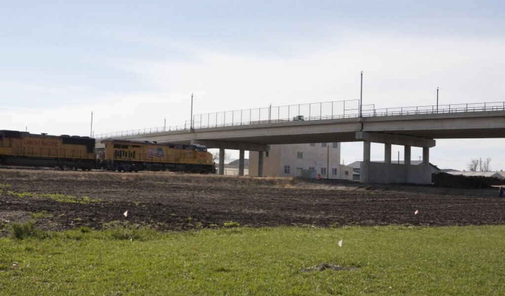 Union Pacific train approaching overpass in Jefferson Iowa.